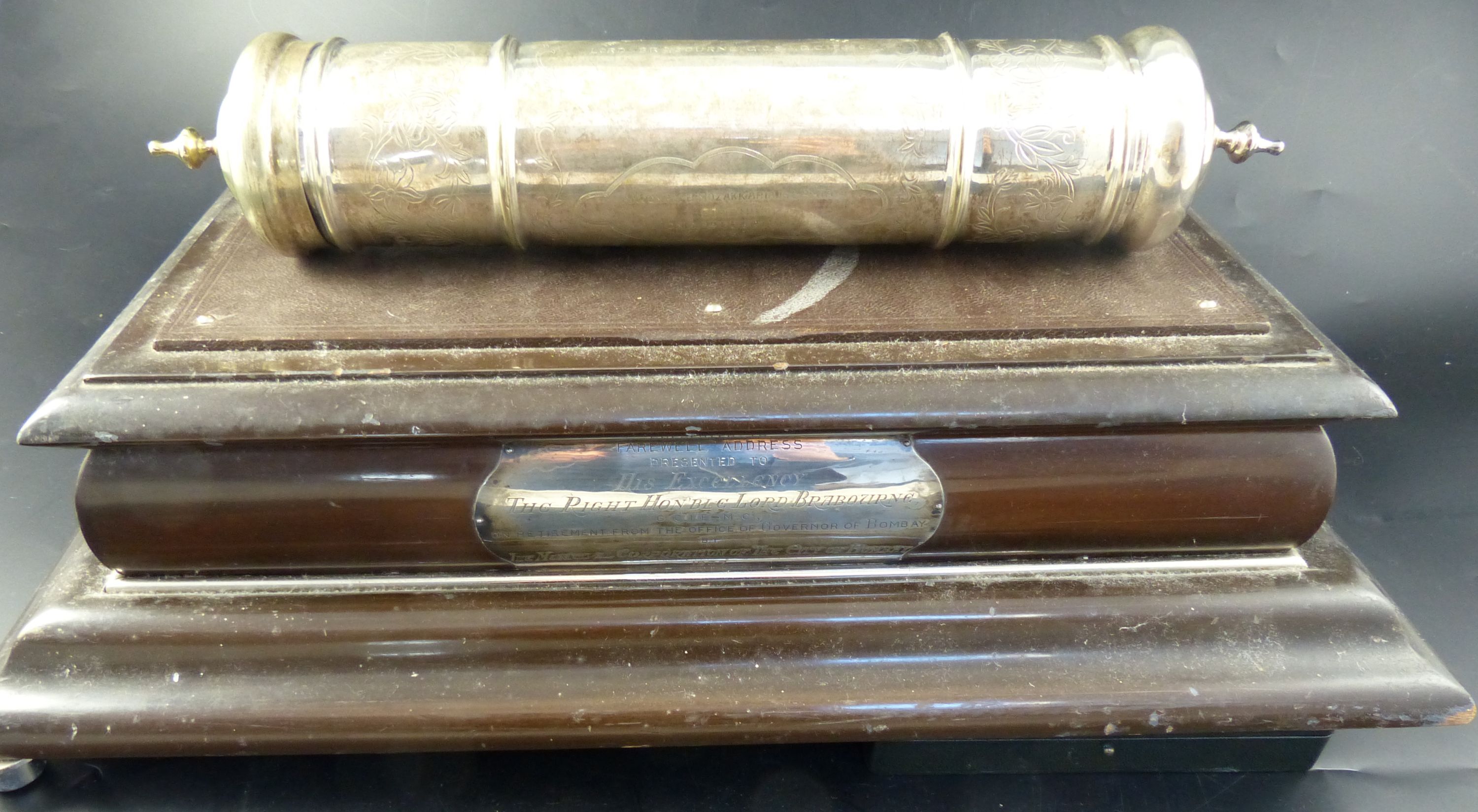 A 1930s Indian silver plated scroll case with presentation inscription to Lord Brabourne, 1938, 38cm and a stand. stand